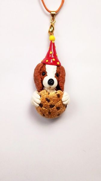 Dog With Cookie Pendant